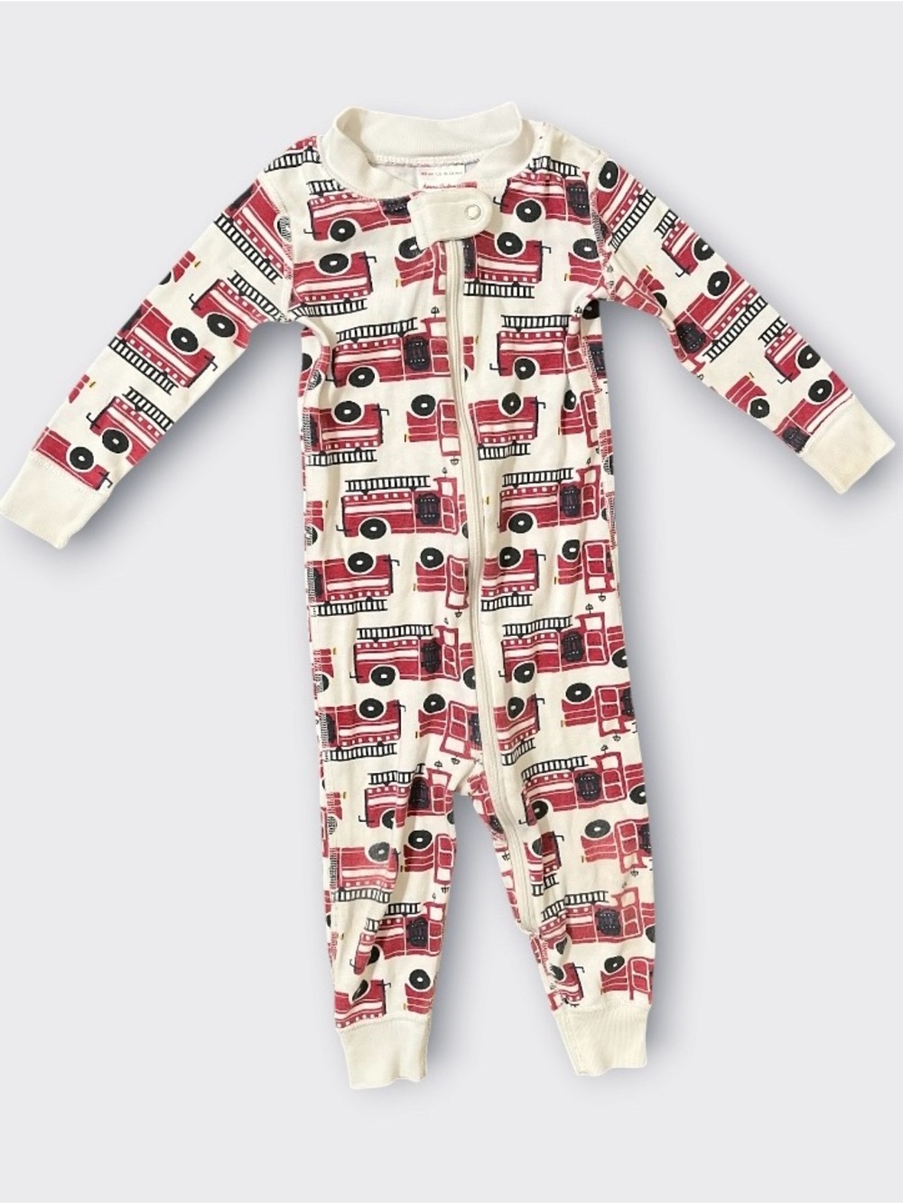 Hanna Andersson Long Sleeve One-Piece Pajamas in Cream with Red Fire Truck Print